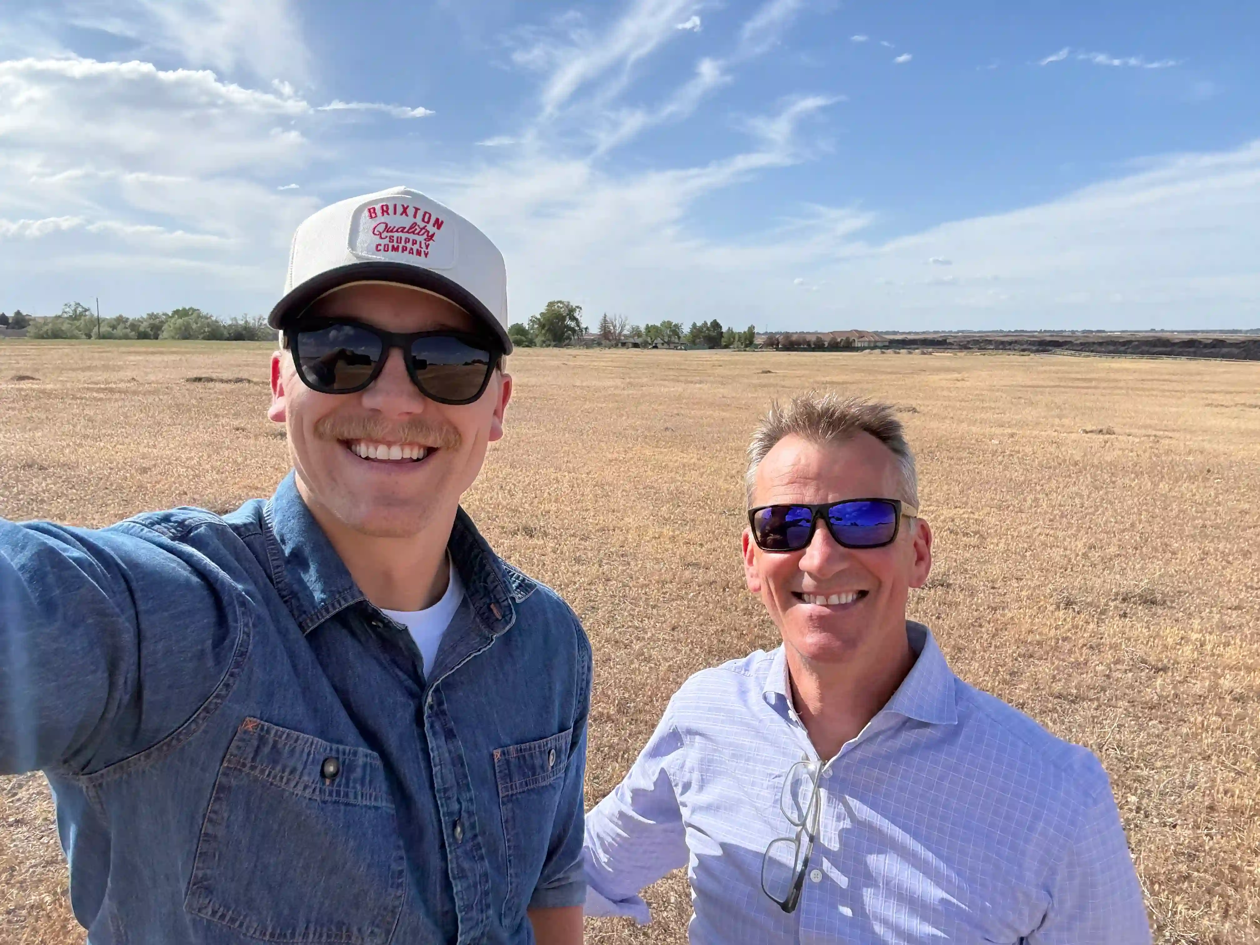 Morgan and Bill taking a selfie on a project site visit